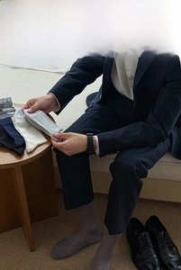 Men's silk business socks styled with blue suit and leather shoes for a formal look