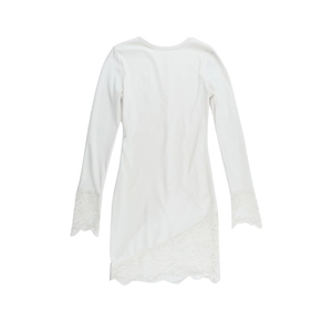 Detail shot of white long-sleeve knit dress featuring delicate lace stitching and V-neckline