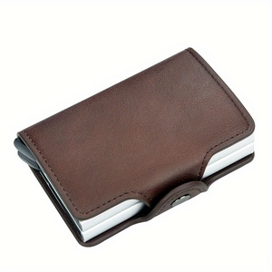 Detail view of brown leather RFID card holder with automatic silver metal pop-up mechanism