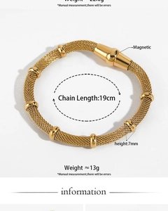 Macro detail of golden mesh bracelet featuring magnetic clasp and circular accents
