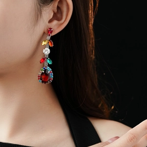 Close-up of elegant vintage drop earrings featuring zircon water droplets on a model
