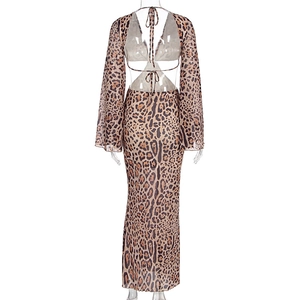 Detail of sexy leopard print mesh long sleeve tie-back top and high waist bodycon skirt