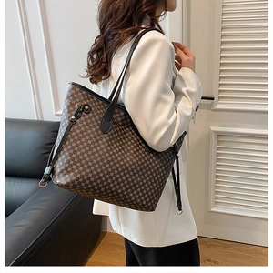 Classic dark brown geometric print tote bag shown on model for elegant office style
