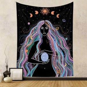 Detail view of bohemian tapestry featuring a celestial goddess holding a glowing star
