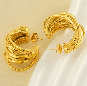 Detailed view of 18K gold plated multi-layer C-shaped hoop earrings with butterfly back