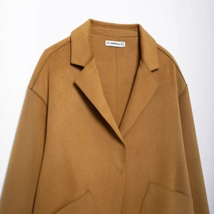 Classic camel wool coat for women with stylish notched lapels and a warm texture finish