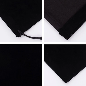 Detail view of black velvet drawstring pouch stitching and soft fabric texture