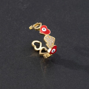 Detail of adjustable evil eye heart ring with red enamel and sparkling zircon pavé