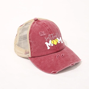 Detail of distressed SOFTBALL MOM hat with mesh back and embroidered heart softball logo