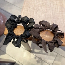 Set of two mesh bow scrunchies in black and dark brown colors for elegant hair styling