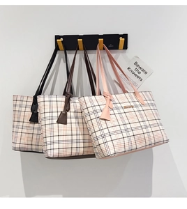Detailed comparison of three plaid tote bags in black, brown, and pink with metal logos