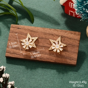 Close-up of gold-plated star earrings with crystal studs, size 1.56cm and weight 3.45g
