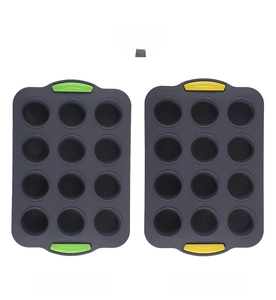 Detailed view of 12-cup silicone muffin pans with colorful anti-slip handles