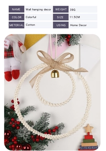Macro detail of Nordic hand-woven cotton wall hanging with beige rope and golden bell