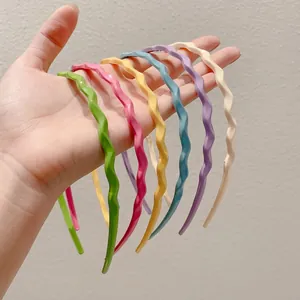 Set of six sweet candy-colored wavy headbands for women in various vibrant pastel shades
