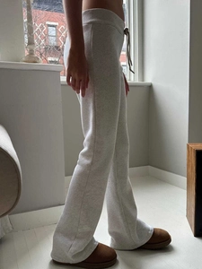 Side view of light grey yoga joggers showing the comfortable fit and cotton blend fabric
