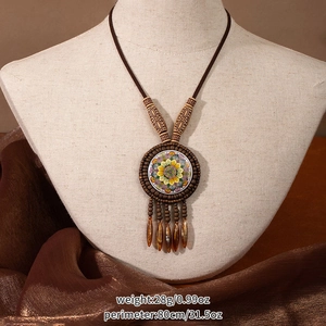Detail of bohemian mandala pendant showing 80cm perimeter and 28g product weight