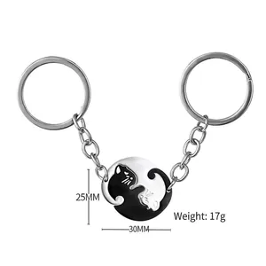 Cat yin yang puzzle keychain set in black and white stainless steel for couples