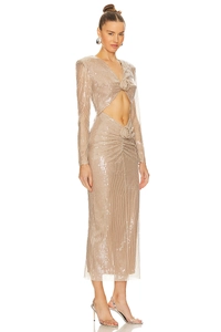 Detailed view of champagne sequin dress featuring waist cut-out and 3D floral decoration
