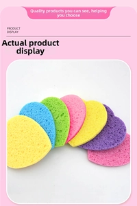 Macro detail of colorful heart-shaped facial sponges showing porous cellulose texture