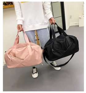 Capacity travel bags in pink and black with dry-wet separation and durable hand straps