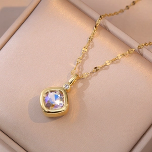 Square clear crystal necklace in gold finish displayed in an elegant jewelry box