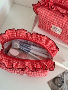 Berry red checkered makeup bag with ruffled edges and large storage for cosmetics
