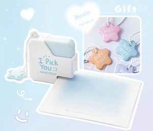 Close-up of cute mini sugar cube stapler with colorful star pendants and logo details