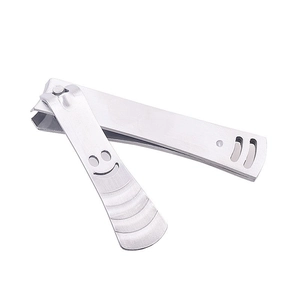 Silver stainless steel nail clipper with non-slip handle and hollow smiley face design