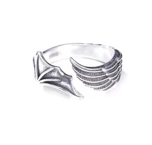 Macro shot of S999 silver stamp and detailed engraving on angel devil wing ring