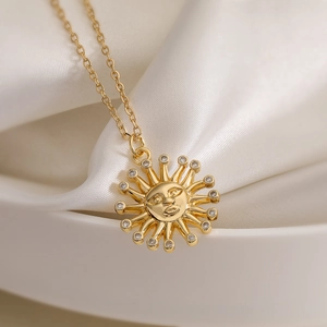18K gold plated sun face pendant necklace with cubic zirconia on white silk