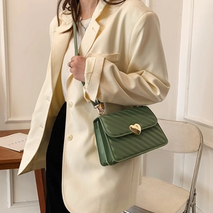 Green pleated crossbody bag with gold heart clasp and diamond stitching for women