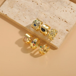 Set of six gold plated rings with zircon evil eye and geometric patterns on stone