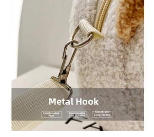 Detailed macro view of the silver metal clasp and texture of the plush sherpa bag