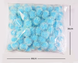 Detailed view of bulk blue crinkle balls in a 36cm by 44cm transparent plastic bag