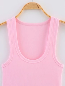 Detailed view of pink ribbed knit texture and U-neckline of a sleeveless vest top