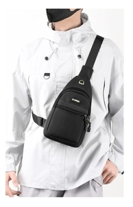 Detail of adjustable strap and buckle on a black waterproof oxford chest bag for men