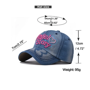Detailed size chart of washed blue denim baseball cap with pink heart embroidery