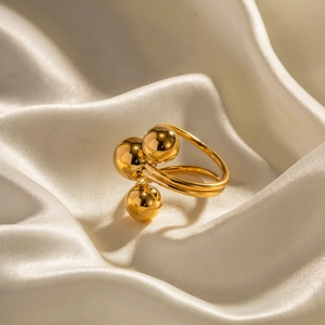 Chunky triple ball 18K gold plated stainless steel open ring on white silk background