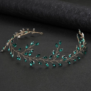 Elegant gold bridal headpiece with emerald marquise crystal leaves for weddings