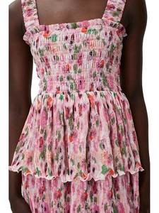 Detail of pink floral smocking and ruffle trim on this summer high-waist mini dress