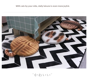 Detail view of round cat-shaped plush seat cushions with cartoon tails in various patterns
