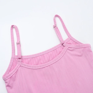 Close-up of pink ribbed camisole with adjustable metal buckles and letter embroidery