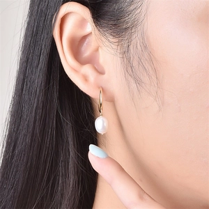 Elegant gold stainless steel hoop earrings with white baroque pearl pendants for women