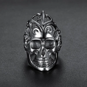 Retro stainless steel skull ring featuring intricate vine patterns and gothic style