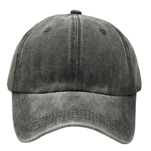 Detailed close-up of vintage washed cotton baseball cap with retro distressed finish