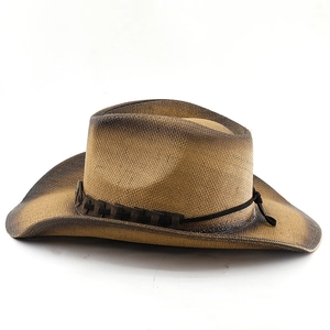 Detail of western straw cowboy hat with gradient brim and cross-stitched leather band