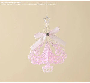 Pink acrylic Christmas tree ornament with glitter finish and a white ribbon bow detail