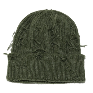 Detailed view of dark green distressed knit beanie with vintage frayed fringe design