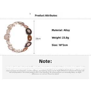 Detail view of elastic bracelet featuring enamel oval charms and clear faceted beads